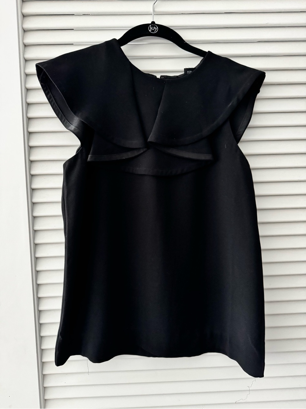 Elegant Black Sleeveless Top with Statement Collar
